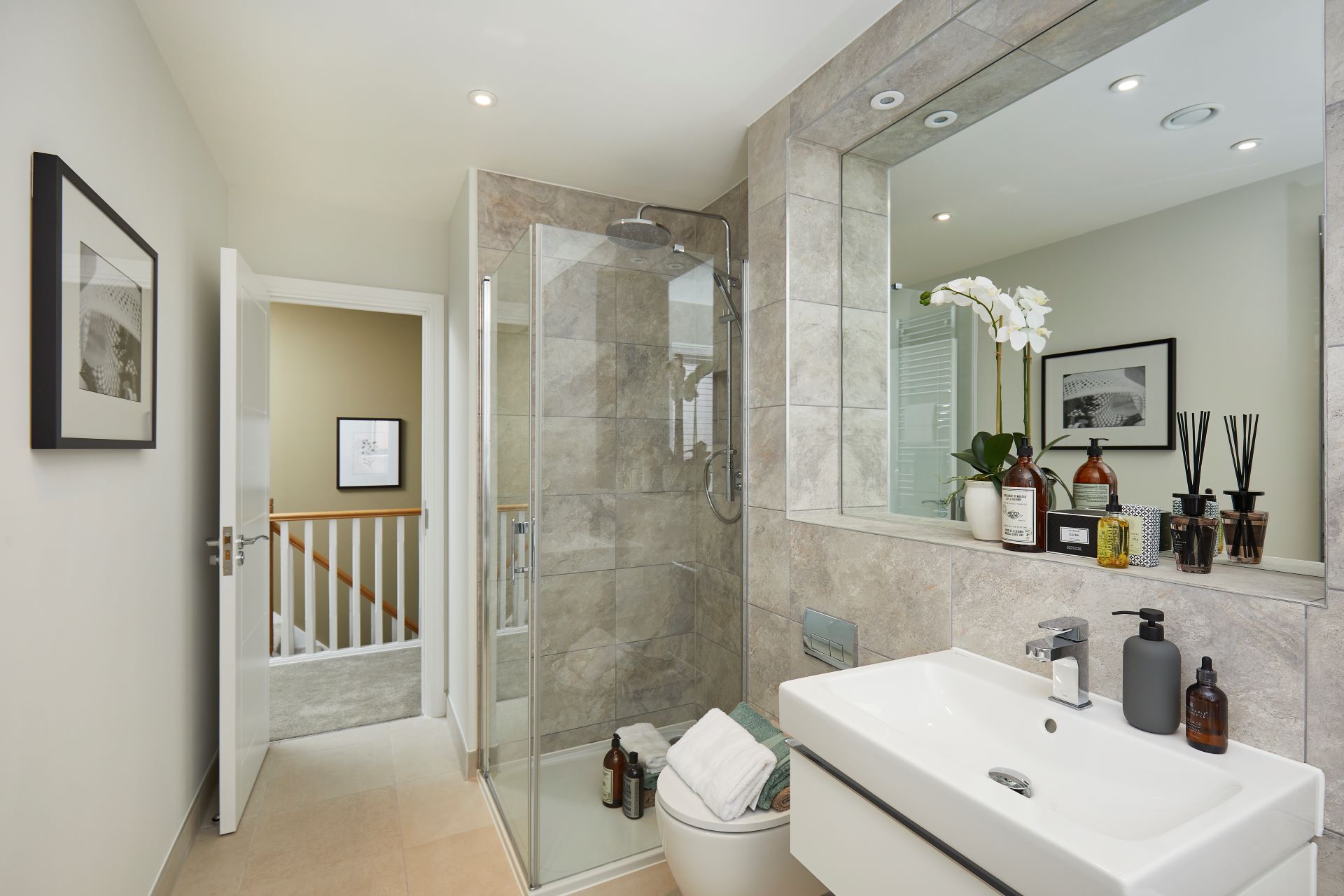 Bathroom with sink and walk in shower and large mirror